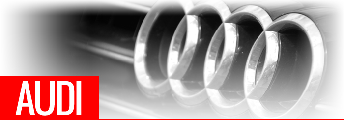 Main Audi Logo Audi text in front of car grill and badge